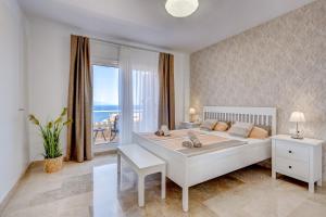 Postel nebo postele na pokoji v ubytování Casa del Sol