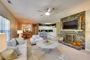 a living room with a fireplace and a tv at Kingwood Resort Condo with Golf Course Views! in Clayton