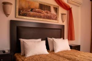 Postel nebo postele na pokoji v ubytování Giannoulaki Resort + 37 fotografií