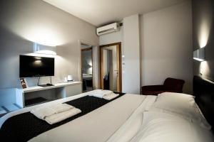 Postel nebo postele na pokoji v ubytování Hotel Delta + 37 fotografií
