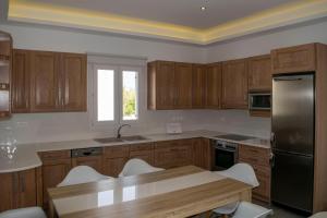 Kuchyň nebo kuchyňský kout v ubytování Giannoulaki Resort