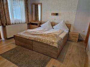 Postel nebo postele na pokoji v ubytování Csalánosi Vendégház
