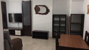 TV a/nebo společenská místnost v ubytování Duplex en el Centro de Huelva