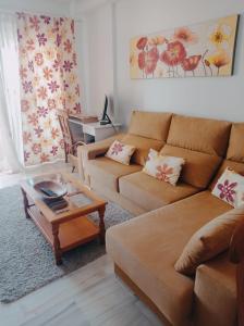 a living room with two couches and a coffee table at Mirador de Denia in Denia