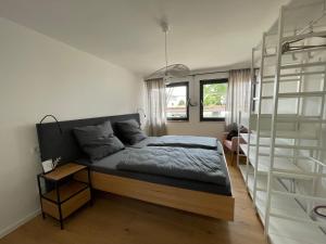 a bedroom with a bed and a book shelf at Mit gutem Gefühl ferienwohnen 