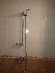 a shower in a bathroom with a shower head at ПРИНЦЕС in Burgas City