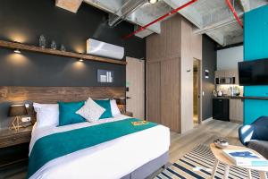 Postel nebo postele na pokoji v ubytování Factory Lofts Hotel