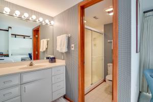 a bathroom with a sink and a shower and a toilet at 325 Beach Club Villa in Seabrook Island +17 photos