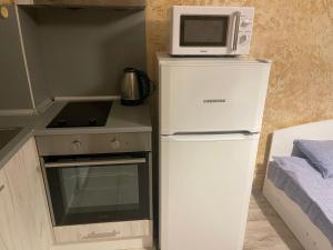 A kitchen or kitchenette at Colonel apartment 956