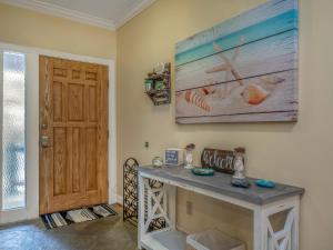 a room with a table and a painting on the wall at 2502 Chateau by the Green in Seabrook Island