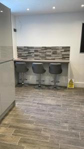 an office with three stools and a counter in a room at Church inn en-suite rooms with Wi-Fi in Moorside