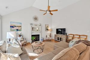 a living room with a couch and a ceiling fan at 2713 Seabrook Island Road in Seabrook Island