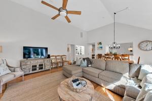 a living room with a couch and a ceiling fan at 2713 Seabrook Island Road in Seabrook Island +35 photos