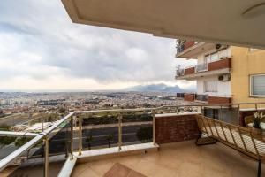 a balcony with a view of a city at Apartment with Panoramic City View in Kepez in Antalya