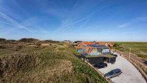 an aerial view of a house on the beach at Strandhotel Camperduin in Schoorl