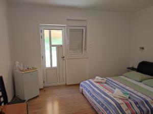Voodi või voodid majutusasutuse Rooms Carija toas
