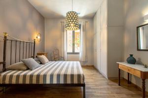 מיטה או מיטות בחדר ב-Casa di Batsi