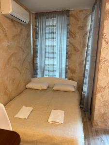 A bed or beds in a room at Colonel apartment 937