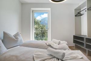 Postel nebo postele na pokoji v ubytování Haus Weinblick Apt 5