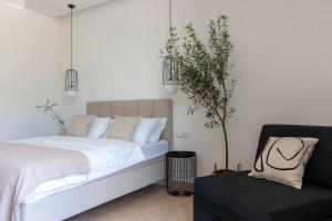 Postel nebo postele na pokoji v ubytování Soho Suites