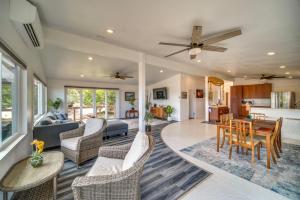 a living room with a couch and a table at Updated Poipu Home Large Deck with Scenic View in Koloa