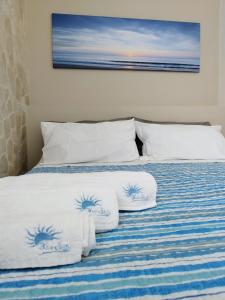 Кровать или кровати в номере BlueSun Apartments