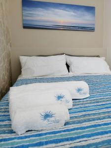 Кровать или кровати в номере BlueSun Apartments