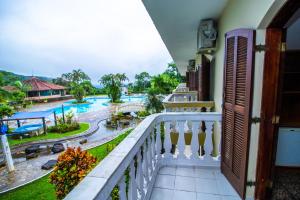 a balcony with a view of a pool at Mata Atlântica Park Hotel in Matinhos