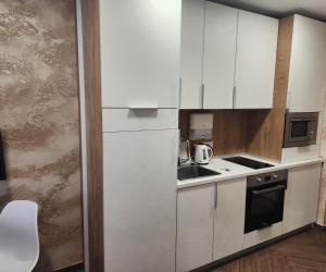 A kitchen or kitchenette at Colonel apartment Luxury