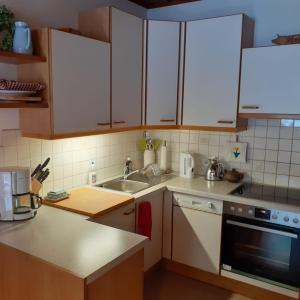Kuchyň nebo kuchyňský kout v ubytování Appartement Hardenack