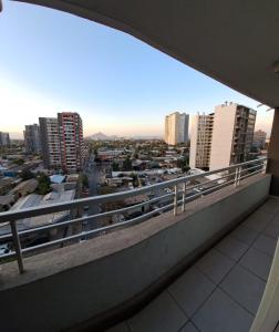 a view of a city from the balcony of a building at Departamento equipado (santiago) in Santiago