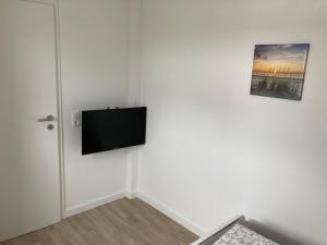 TV a/nebo společenská místnost v ubytování Helle Fewo Haus 29a, 2. Obergeschoss