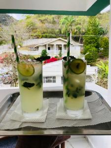 two drinks on a tray on a table at Loma Alta Hotel Boutique in Polo