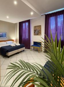 Postel nebo postele na pokoji v ubytování Hotel Leopolda