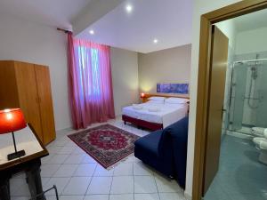 Postel nebo postele na pokoji v ubytování Hotel Leopolda
