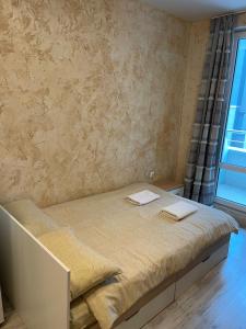 A bed or beds in a room at Colonel apartment 938