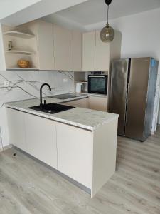 Kuchyňa alebo kuchynka v ubytovaní Eva Apartment 2