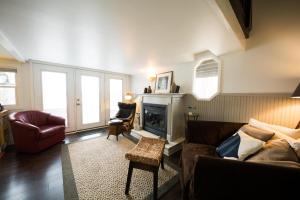 a living room with a couch and a fireplace at Lake House in Nashville