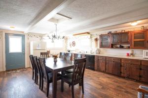 a kitchen with a table and chairs in a kitchen at Sugar Cottage in Nashville