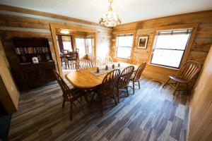 a dining room with a table and chairs at Grand Cabin in Nashville