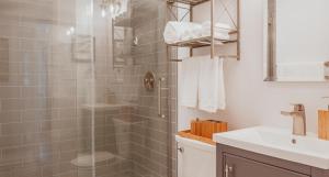 a bathroom with a shower and a sink at Printers Lane Place in Nashville +19 photos