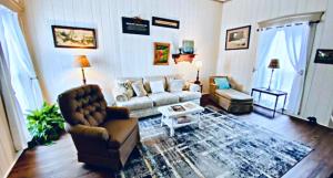 a living room with a couch and a table at Nashville Suite 2 in Nashville