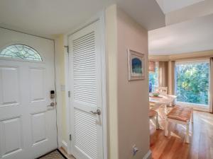 a door leading to a dining room with a table at 779 Spinnaker Beach House in Seabrook Island