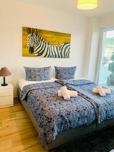 En eller flere senge i et værelse på Apartment-Hohenstein