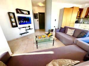 a living room with a couch and a table at Ocean view Apartment in Rhodes Town
