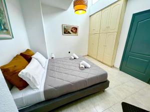 a bedroom with a bed with towels on it at Ocean view Apartment in Rhodes Town