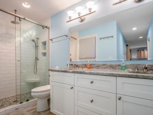 a bathroom with a shower and a sink and a toilet at 2631 Seabrook Island Road in Seabrook Island +31 photos