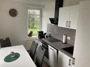 Kuchyň nebo kuchyňský kout v ubytování Neu errichtete schöne Wohnung Haus 29a 1. Obergeschoss
