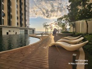 a rendering of a walkway near a building at Seaview Luxury Suites at The Shore Kota Kinabalu in Kota Kinabalu