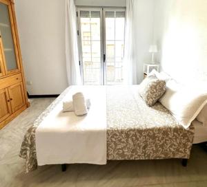 Posteľ alebo postele v izbe v ubytovaní Apartamento Claudio Marcelo, 1